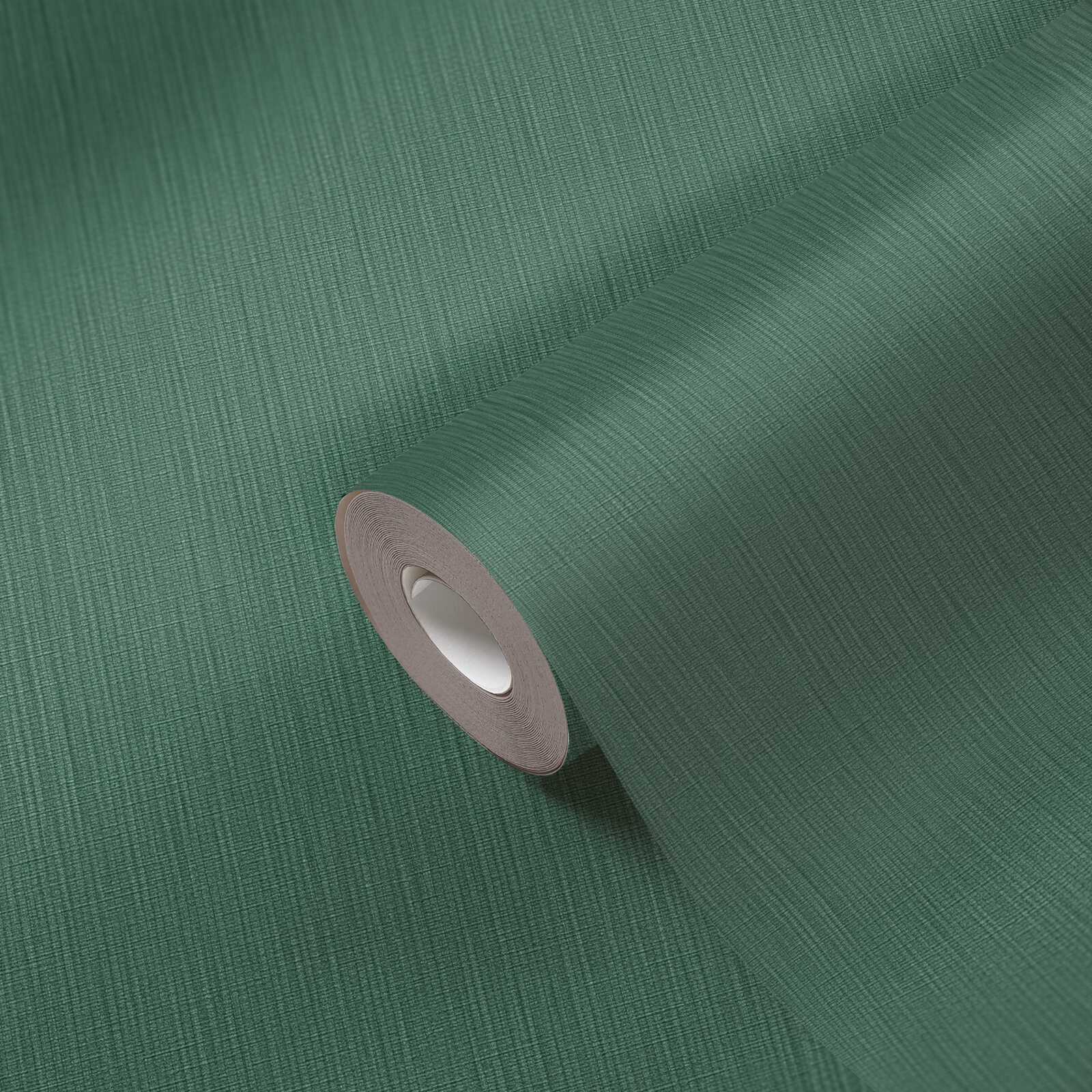             Single-coloured non-woven wallpaper with a textured effect in a dark shade - Green
        