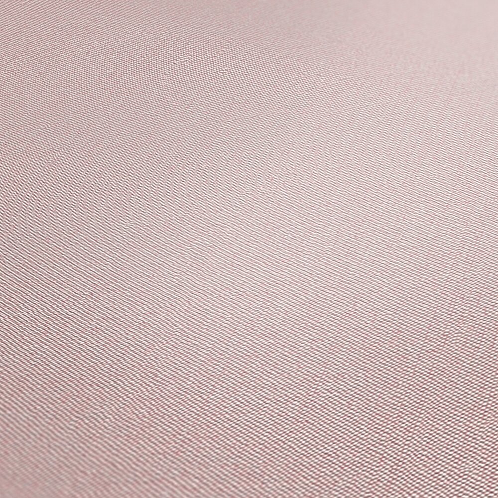             Plain non-woven wallpaper with surface texture - pink
        