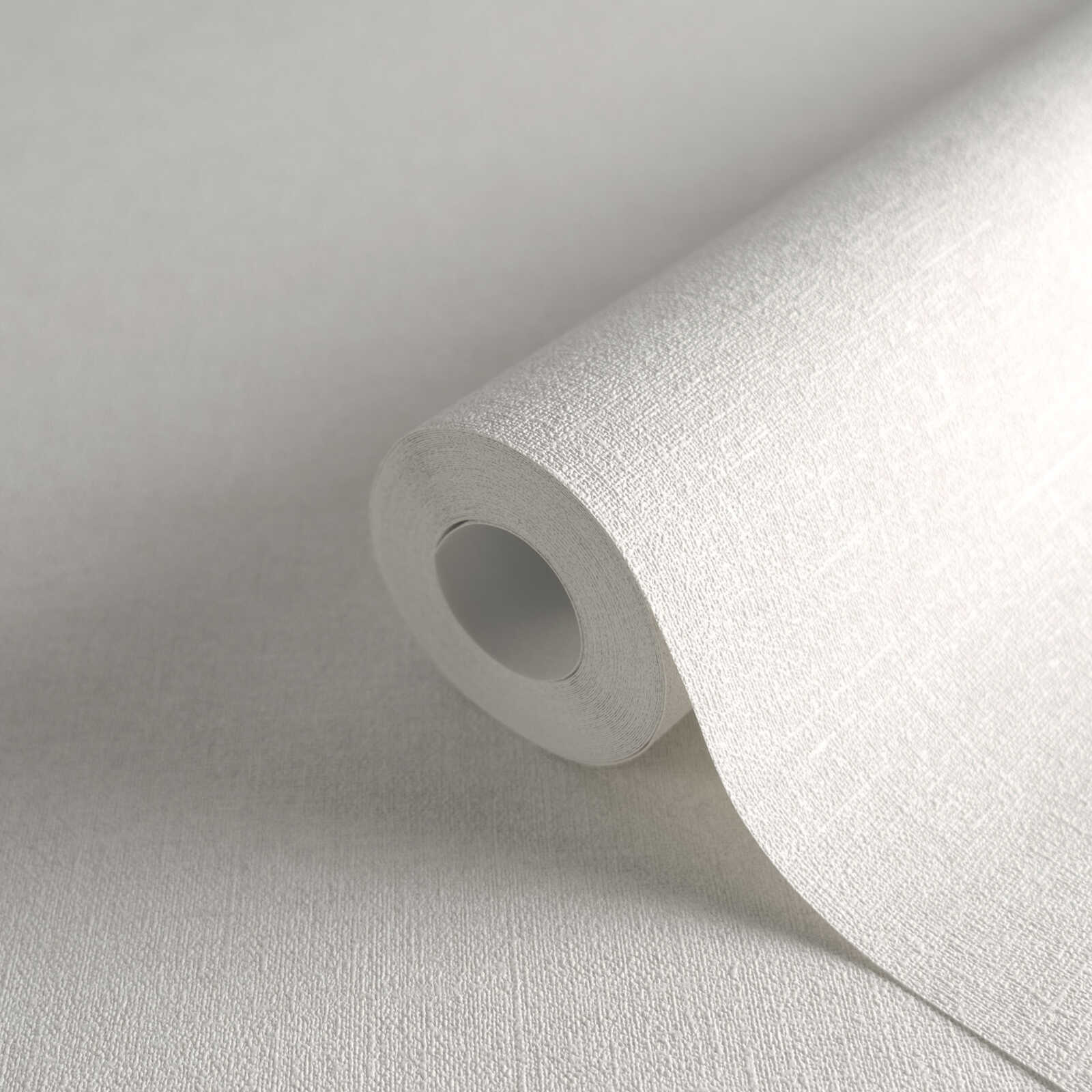             Papier peint uni blanc crème, mat avec motifs structurés
        