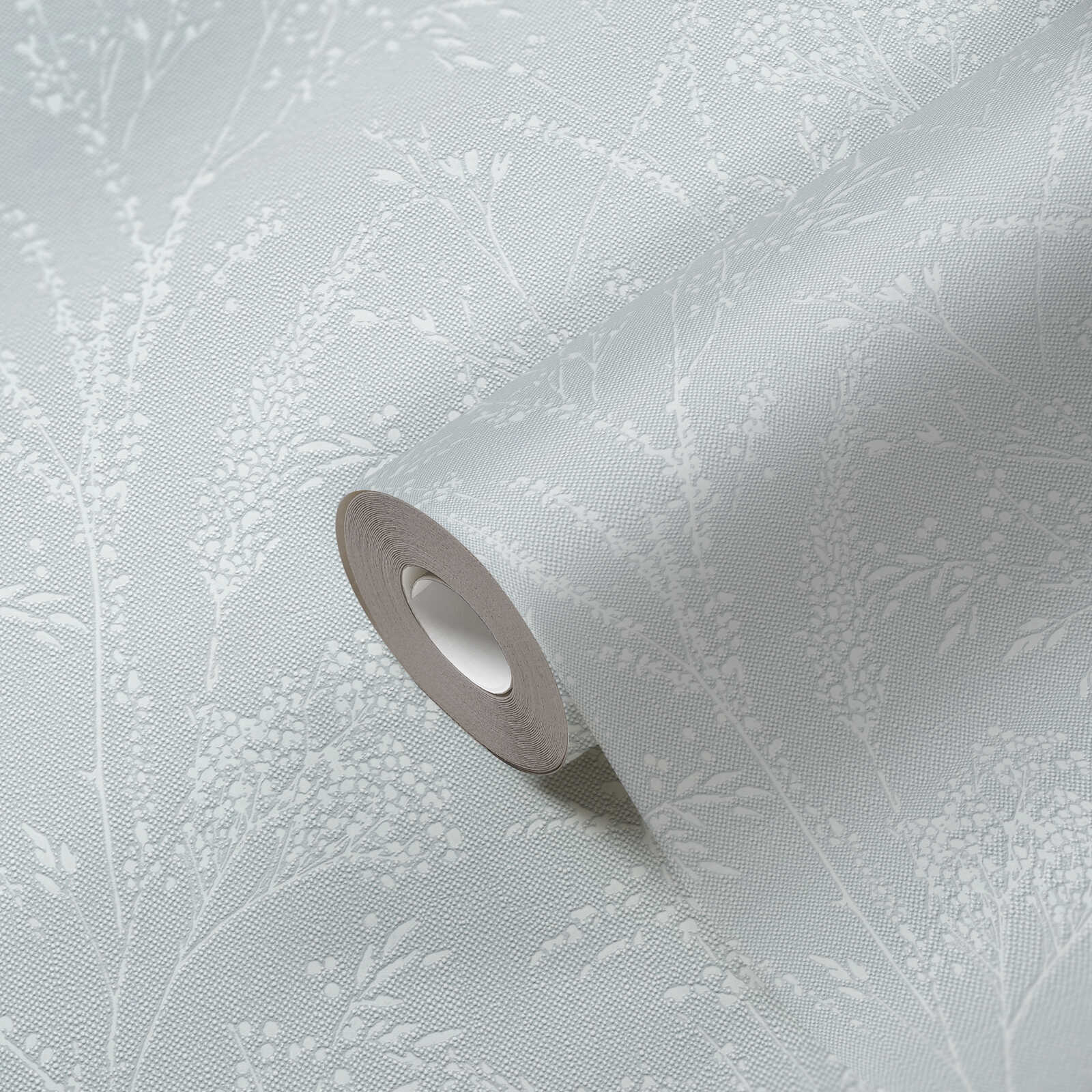             Non-woven wallpaper with glittering floral and tendril design on textile surface - light blue, white
        