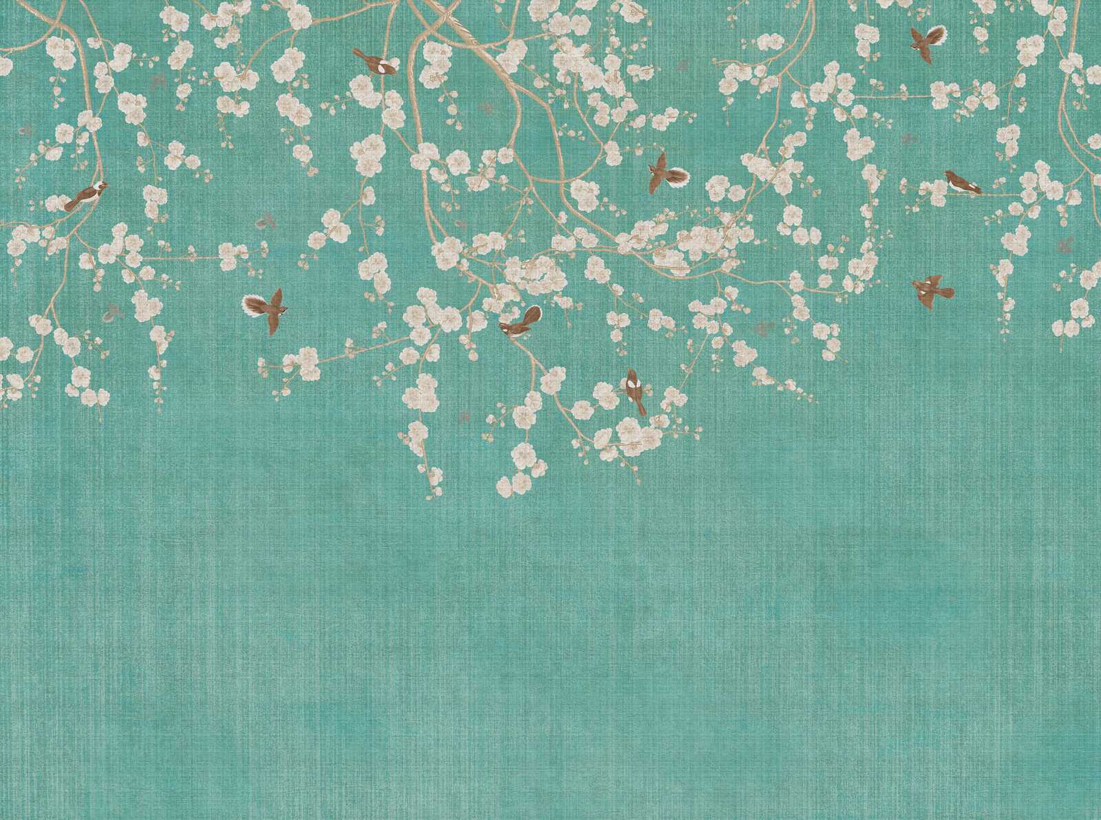             Elegant non-woven wallpaper with blossoming cherry branches - blue, cream, beige
        