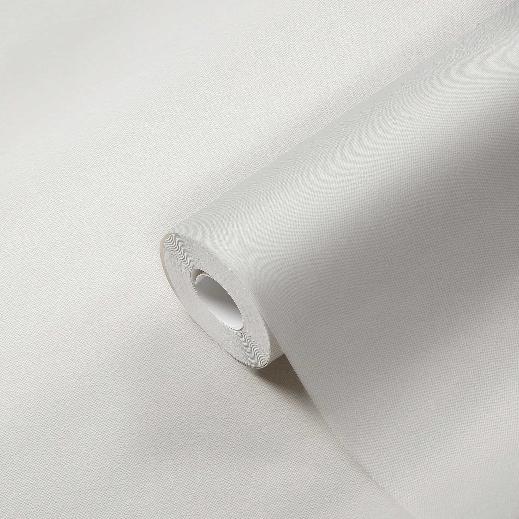             Papel pintado monocolor de tejido-no tejido con acabado mate y textura textil fina - blanco
        