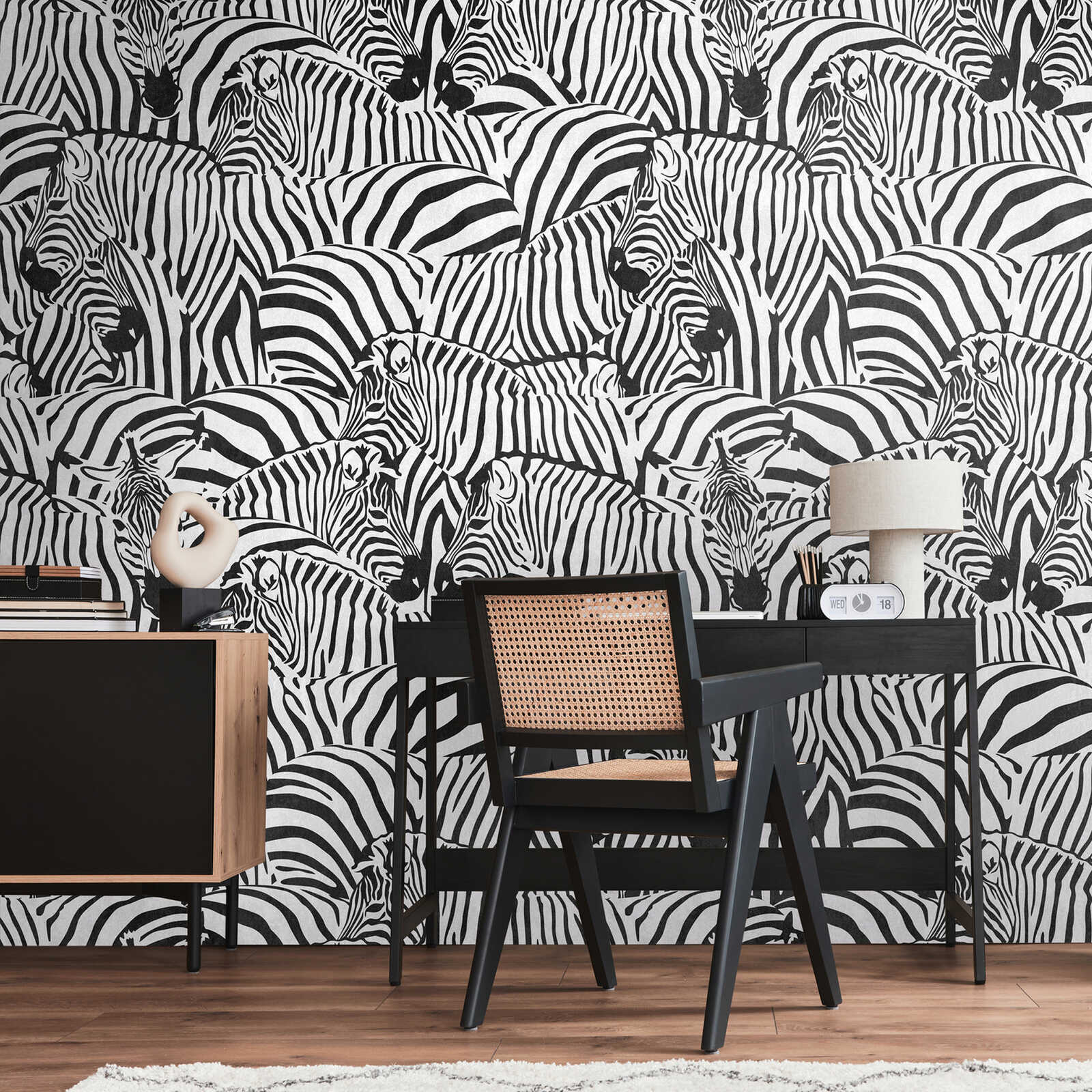             Striking black and white safari non-woven wallpaper with zebras and large-scale pattern repetition - black, white
        