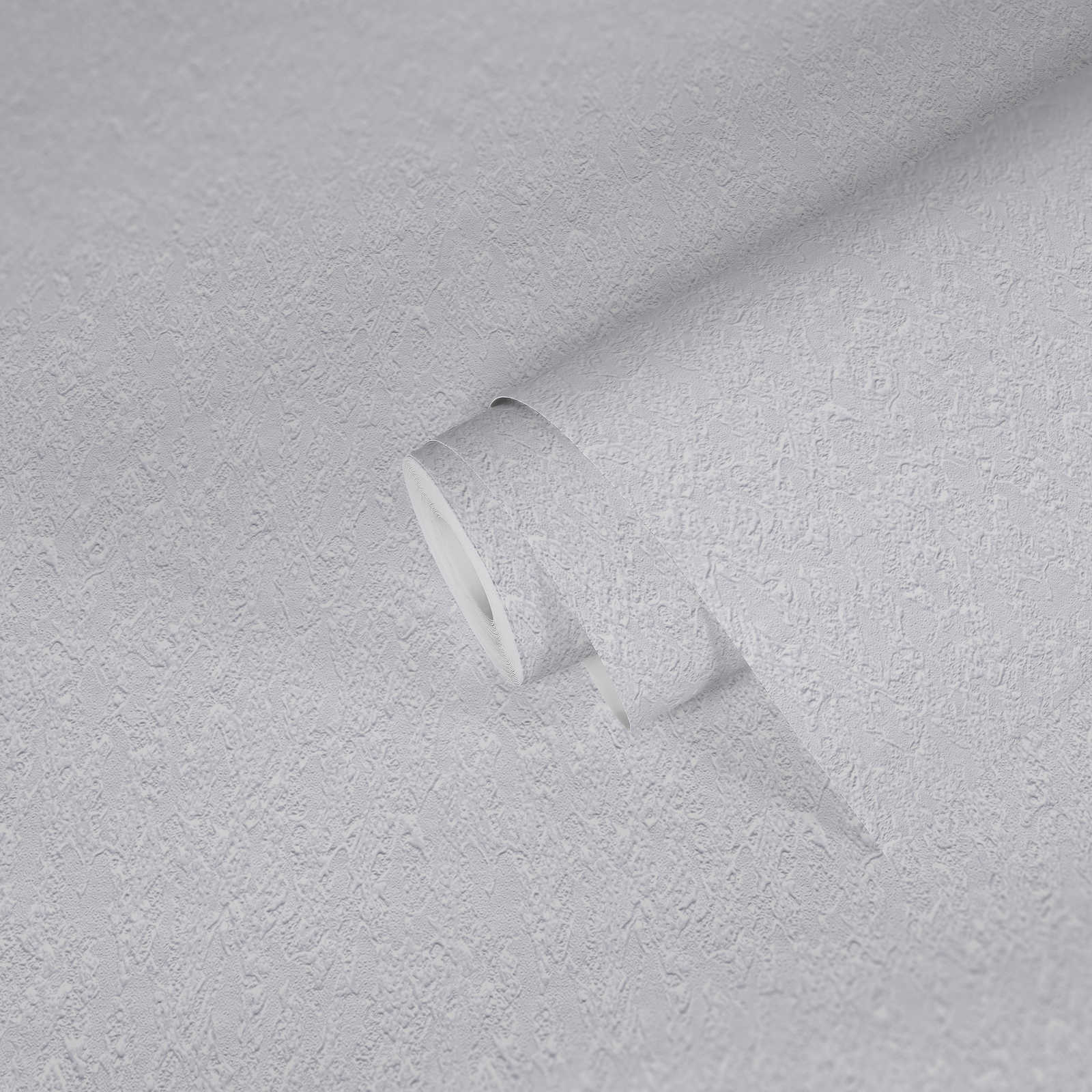             Papel pintado blanco con efecto texturizado en aspecto de yeso
        