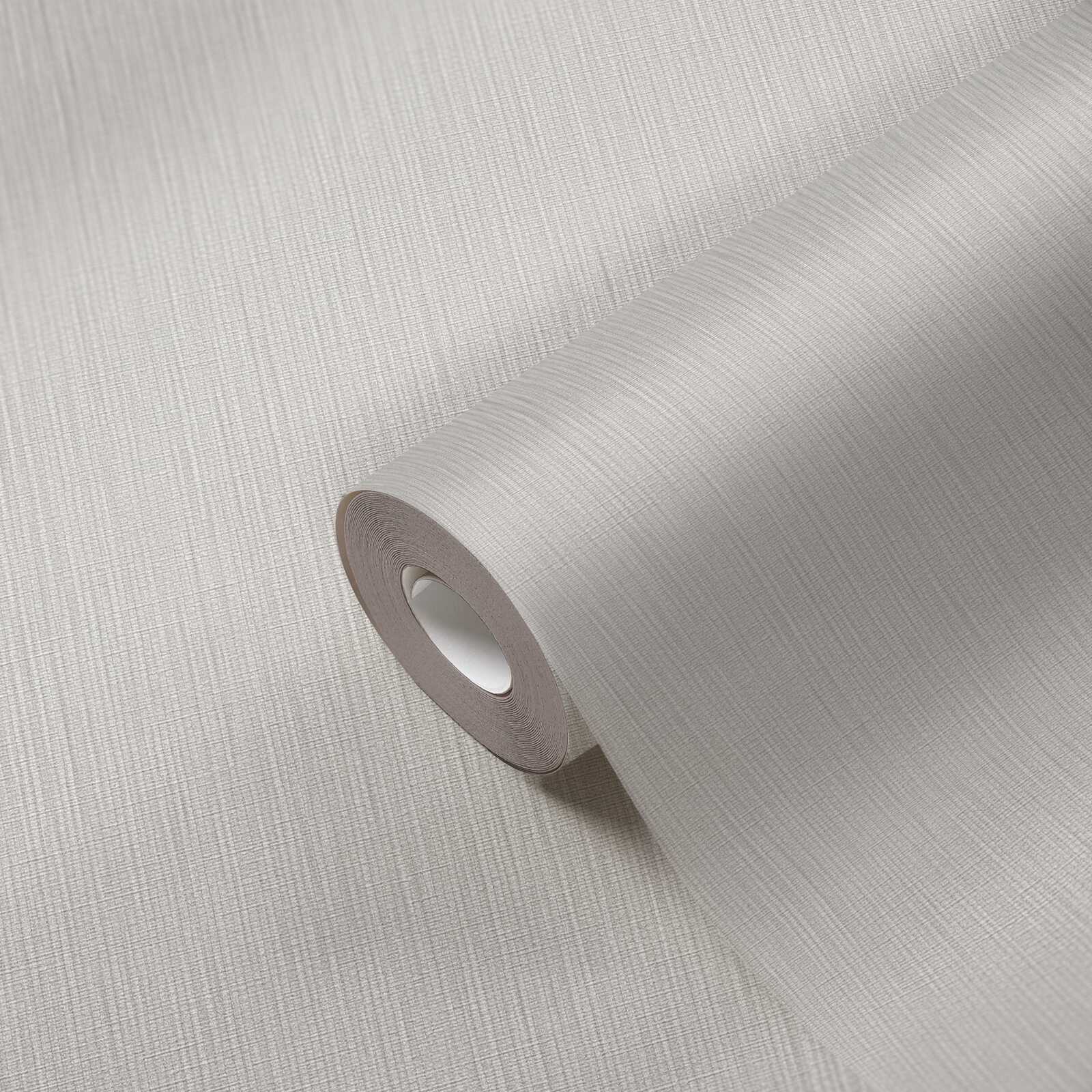             Single-coloured non-woven wallpaper with a light textured effect - grey
        