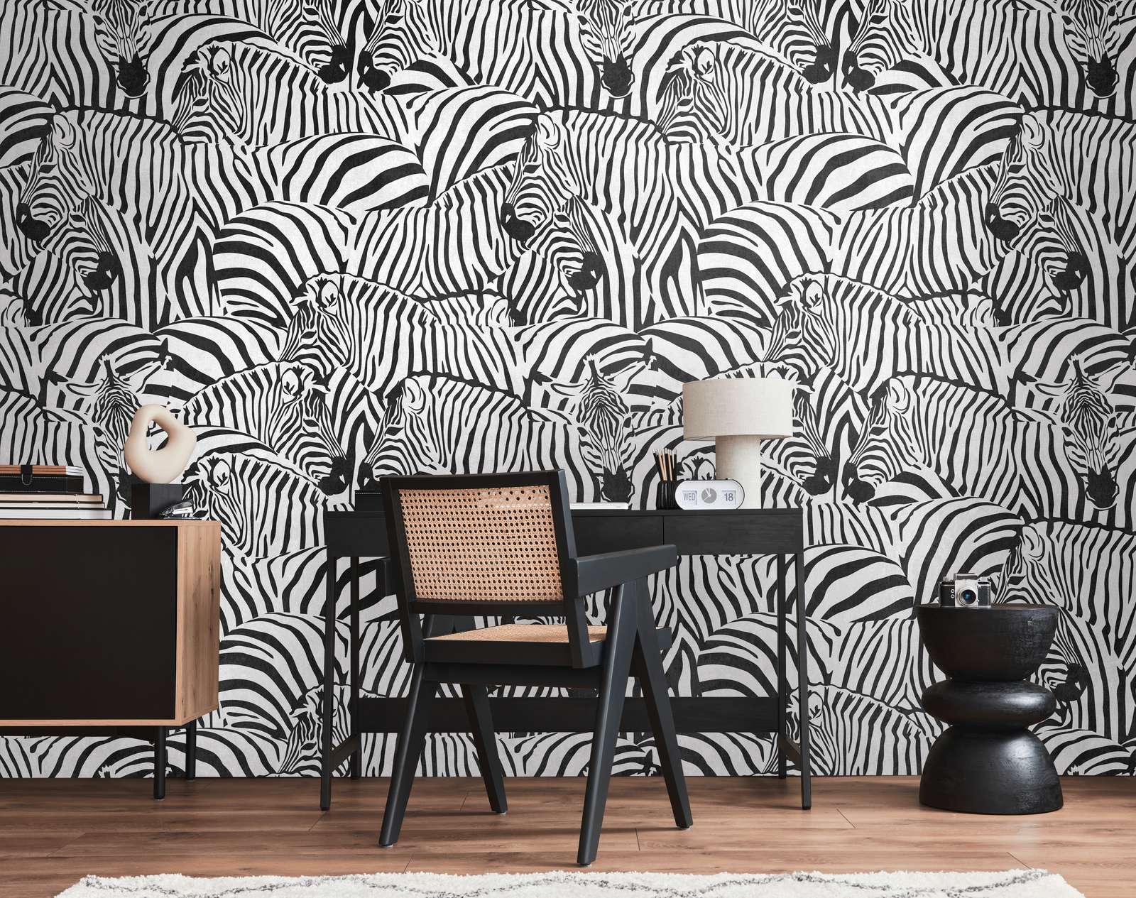             Striking black and white safari non-woven wallpaper with zebras and large-scale pattern repetition - black, white
        