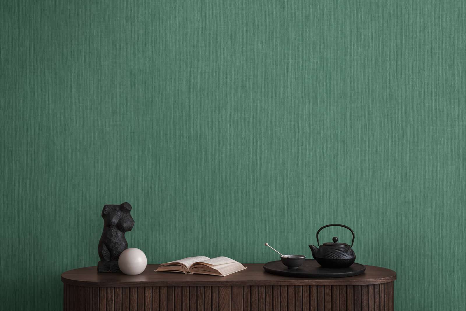             Single-coloured non-woven wallpaper with a textured effect in a dark shade - Green
        